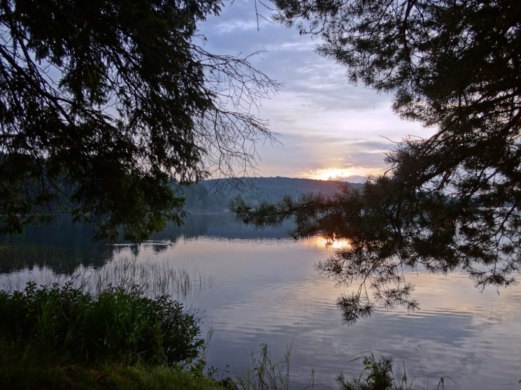 The sun rises over the Lake of Two Rivers, as viewed from Killarney Lodge.