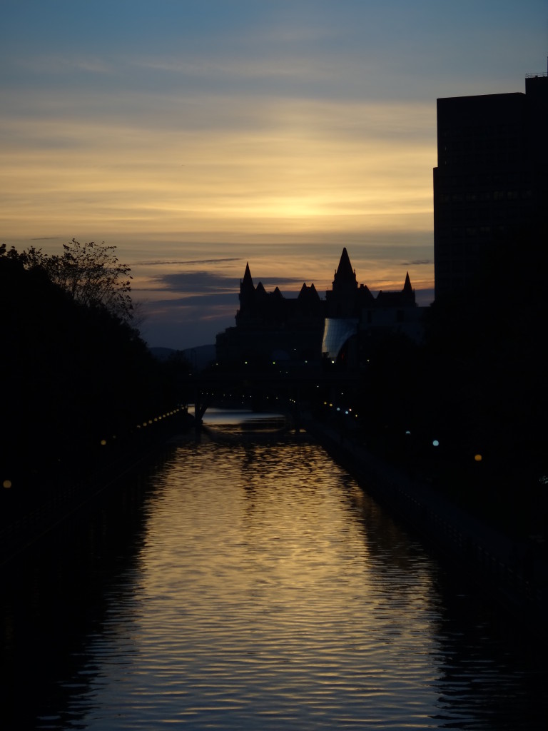 A photograph of sunset over the Rideau Canal from the Corkstown Footbridge.