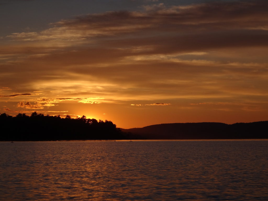 The settng sun turns the sky burnished copper over the Ottawa River